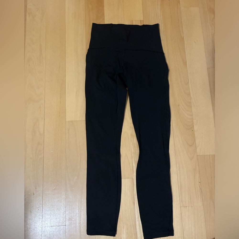 Black lululemon leggings size 4 with mesh on back from calf down